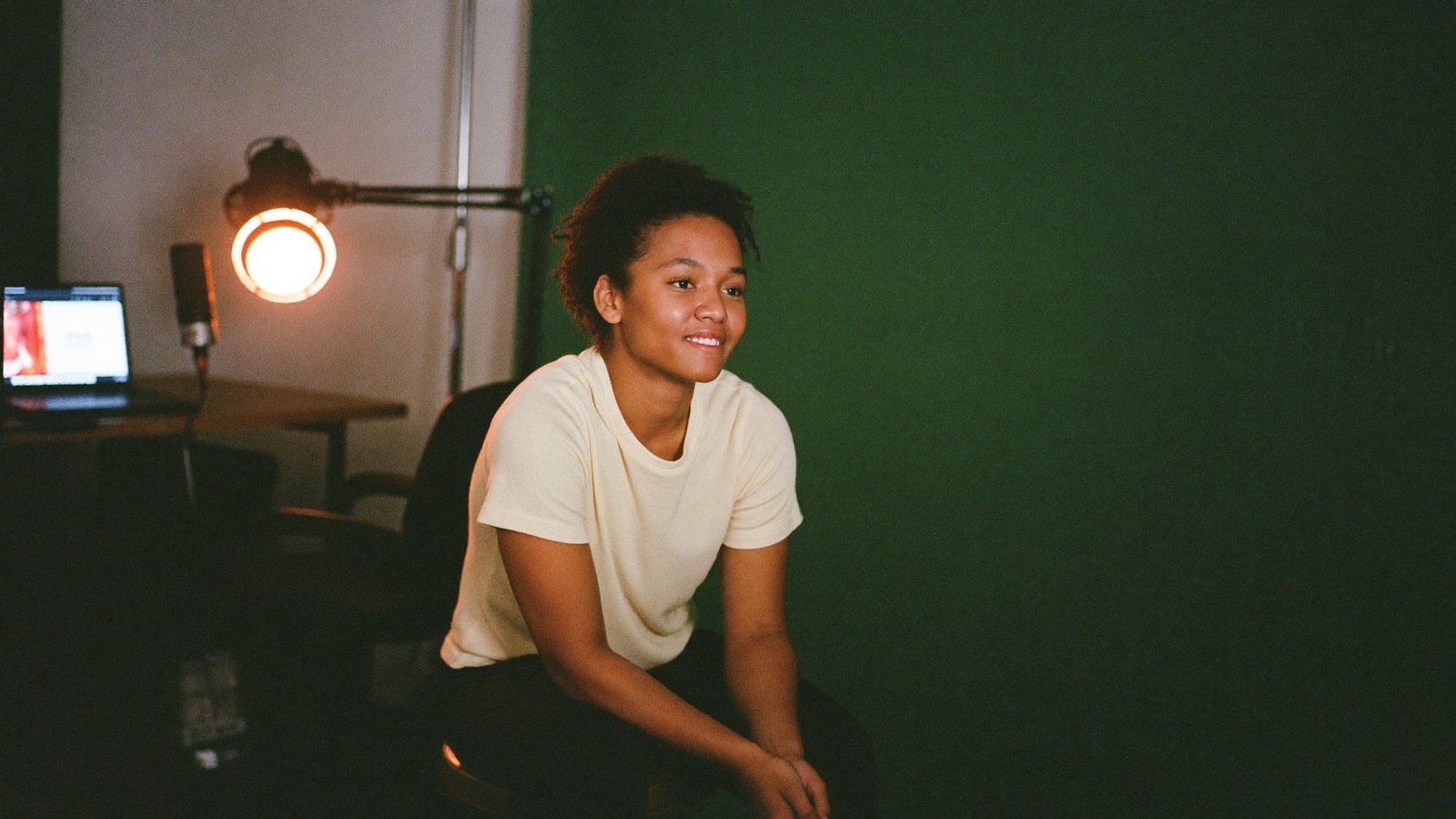 A creator recording content in her home studio