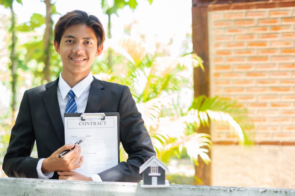 Home Insurance Concept And Real Estate. Business Asian Man With