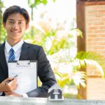 Home Insurance Concept And Real Estate. Business Asian Man With