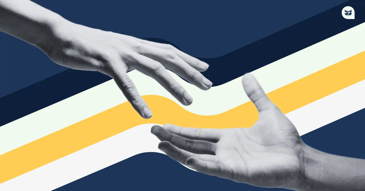 two hands reaching out together to achieve the common goal