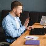 Disabled Virtual Assistant In Wheelchair Making Remote Video Call.