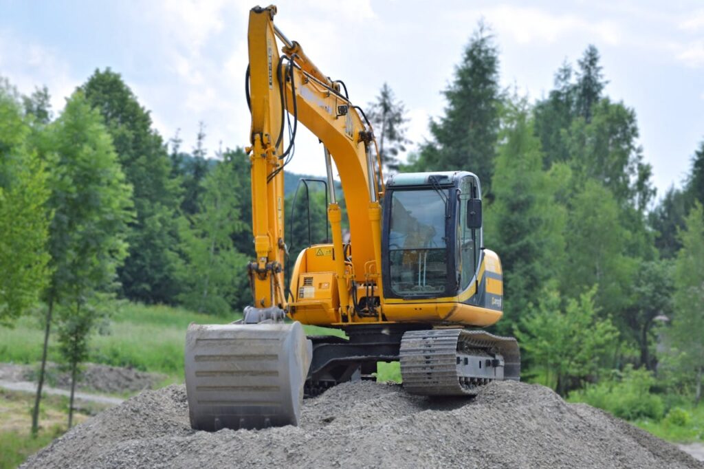 Yellow excavator at a construction site - excavation advertising ideas