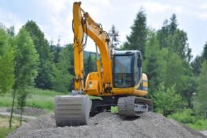 Yellow excavator at a construction site - excavation advertising ideas