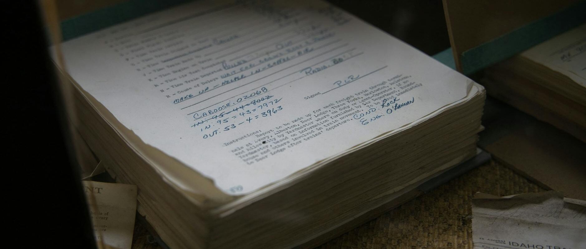 Old railroad papers in Avery, Idaho showcasing historical records and transportation details.