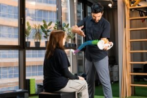Chiropractor demonstrating with spine model