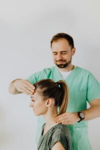 Therapist performing neck adjustment