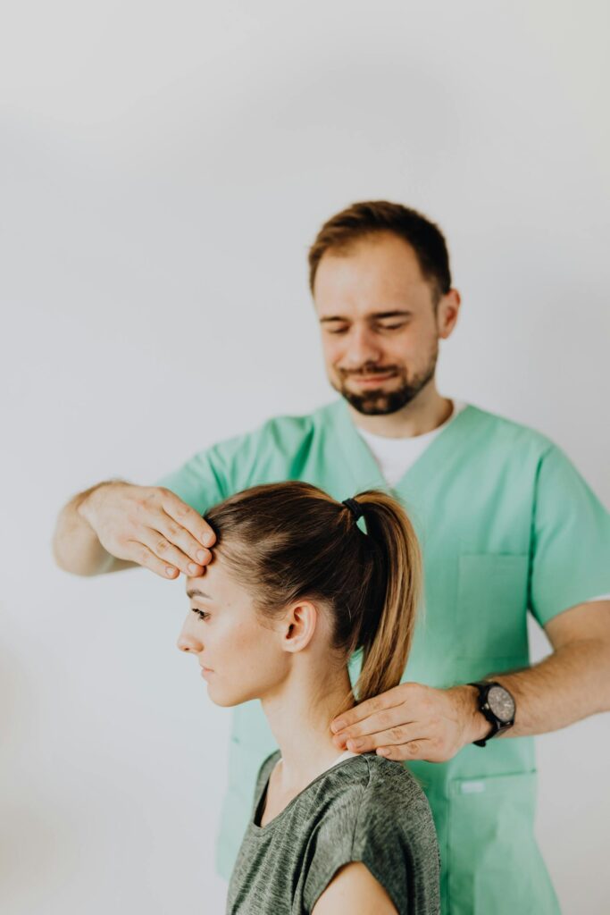 Therapist performing neck adjustment