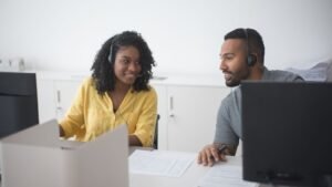 Manager reviewing a contact center outsourcing provider with a colleague