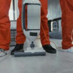 Cleaning crew vacuuming residential interior