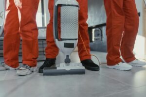 Cleaning crew vacuuming residential interior