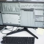 Contact center analytics on a monitor showing performance metrics