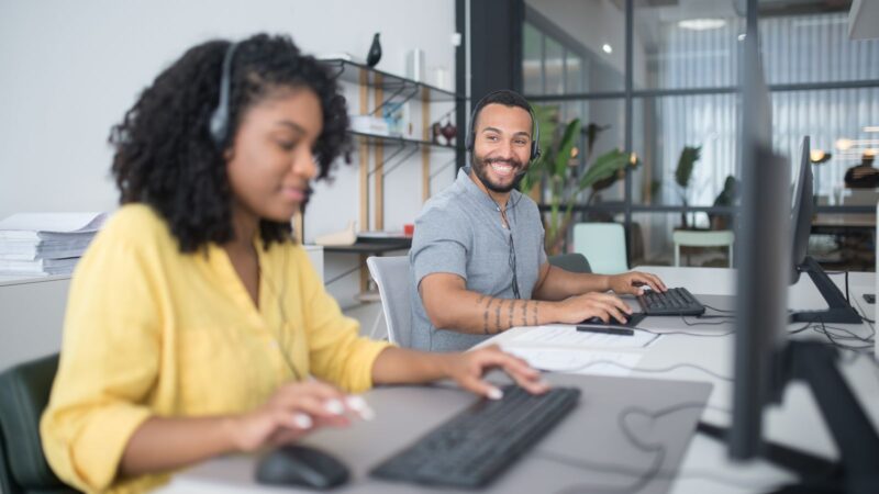 Customer support team working together in a modern office