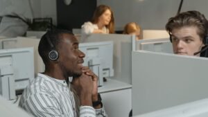Customer support team working with headsets in an outsourced contact center