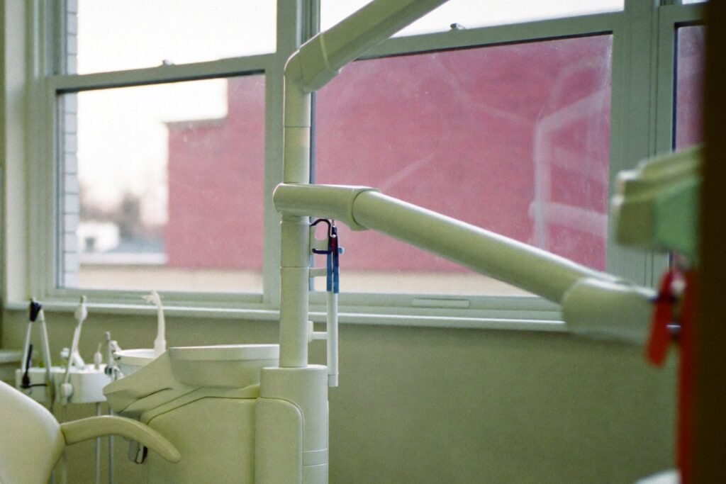 Empty dental operatory chair by a bright window, representing dental virtual assistant companies