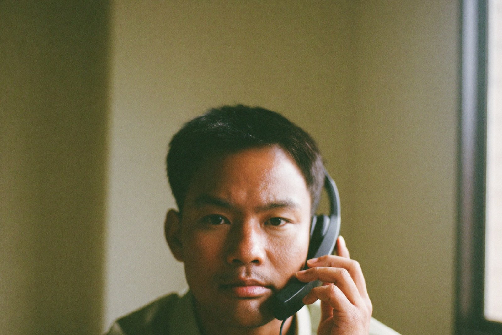 Filipino SDR wearing a headset on an outbound call